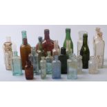 Twenty three various glass bottles including Spencer's West Bromwich, Masons Wine Essences