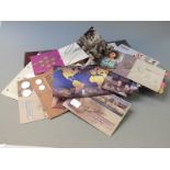 An album of Great Britain coin/stamp covers and stamp booklets including over £50 in redeemable