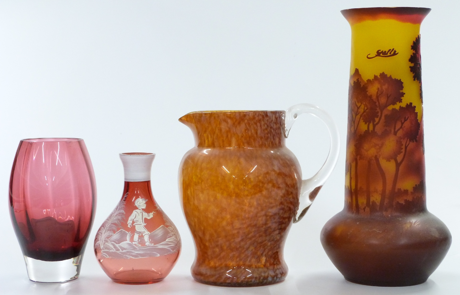 Four glass three glass vases comprising a Galle style cameo glass vases with red decoration of trees