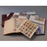 Two albums of first day covers and a book of stamps