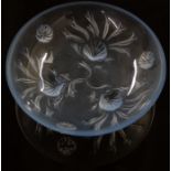 French Lalique style glass bowl decorated with foliage and with three feet in the form of shells,