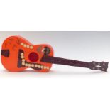 Beatles Big 6 toy acoustic guitar, orange plastic body with faux autographs, fitted with nylon