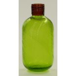 A green art glass bottle vase with wrythen moulded body and trailed brown collar, 25cm tall.