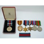 British Army WWII medals comprising 1939/1945 Star, France and Germany Star, War Medal and Defence