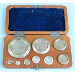 Edward VII cased set of County of Monmouth standard weights from 8oz to 1/2 dr, all numbered 2897