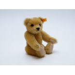 Steiff Classic 1909 Teddy bear with blonde mohair, felt pads, growler and jointed limbs, 24cm tall