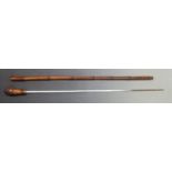 An early 20thC bamboo swordstick with 75cm graduated steel blade, overall length 88cm.