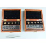 Two George V cased sets of County of Monmouth standard weights 100 grain downwards, larger weights