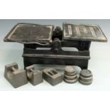 J & J Siddons Ltd 1cwt scales, width 65cm and ten assorted weights including William Cross and Son