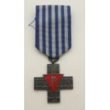 A reproduction WWII Polish Auschwitz cross