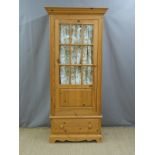 Glazed pine wardrobe or hall cupboard with drawer below, W88 x D60 x H196cm