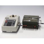 Two Facit vintage mechanical calculators, the older example numbered  218565