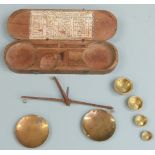 18thC / 19thC French travelling beam scale with cup and flat weights, the lid with table of coin