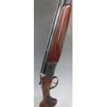 Baikal NX-27E 12 bore over and under ejector shotgun with engraved scenes of birds to the lock,