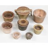 A quantity of various nesting cup weights including an outer case, largest weight 8oz