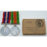 British Army WWII medals comprising War Medal and Defence Medal with box addressed to Mrs E.M.R.