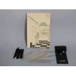A lock picking set with a Complete Guide to Lock Picking