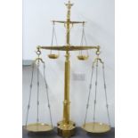 19thC Portuguese brass bull's head double floor standing beam scale, with weights to base from 5kg