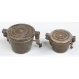 Two cased runs of bronze nesting cup weights, height of larger 3.5cm