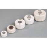A run of cylindrical ceramic weights 200g to 20g