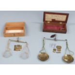 Two sets of 19thC travelling beam scales, one with list of weights to interior of lid. Width of case