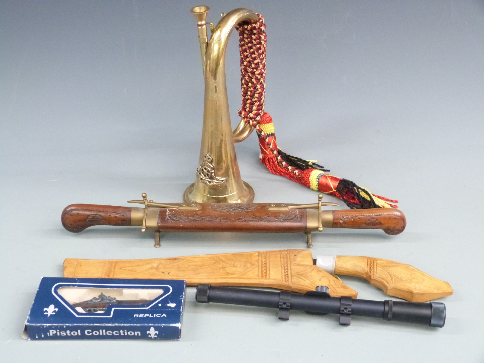 Rifle scope, military bugle, knives, Indian carving set etc