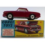 Corgi Toys dicast model Volkswagen 1500 Karmann Ghia with maroon body and yellow interior 239, in