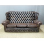 Brown leather Chesterfield sofa, length 184cm