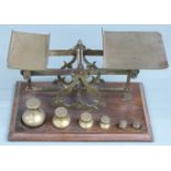 Victorian brass postage scales with rates to pan and bun-shaped weights to base from 8oz