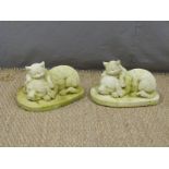 Pair of garden models of a dog and cat asleep, height 18cm
