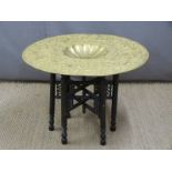 Thai/Burmese or similar gilt metal-topped table with embossed top, D77cm