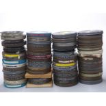 Approximately 65 16mm cine film reels including examples titled 'Neptune Nonsense', 'Felix the Cat',