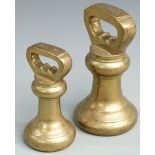 Two Georgian / Victorian brass bell weights comprising 14lb and 7lb stamped with GR cipher to base