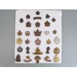 Approximately 30 WWI/WWII Canadian Army cap badges/ insignia including Cameron Highlanders,