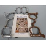 Three pairs of vintage handcuffs, book etc