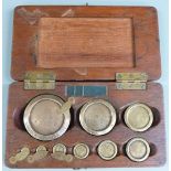 Victorian cased set of Borough of Eastbourne county standard weights, 8oz to 1/2 dram, all but