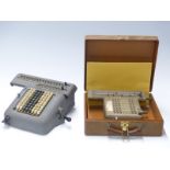 Two vintage mechanical calculators, one Madas the other a Monroe example in case