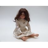 Armand Marseille bisque headed doll with open mouth, weighted blue eyes, long brown hair and