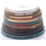 Ten 16mm cine film reels including examples marked 'Time is Don Levy',  'Rhodesia Countdown, Mark