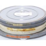 Three vintage Laurel & Hardy 16mm cine film reels marked 'Love 'em & Weep', 'Hog Wild' and 'The