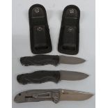 Two Waltner pocket knives with canvas sheaths together with a CRKT Drifter example