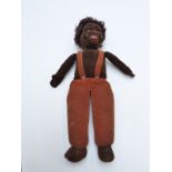 Norah Wellings vintage doll with brown felt body, glass eyes and brown curly hair, 37cm tall