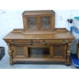 Art Nouveau oak sideboard with bevelled astragal glazed cabinet to top, the base fitted three