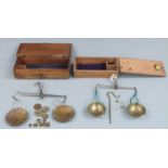 Two sets of 18thC / 19thC travelling beam scales including various apothecary weights