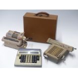 Three vintage mechanical calculators comprising Mentor, Contex and Monroe in case