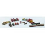 Twenty four Dinky Toys and Matchbox Lesney 1075 series diecast model vehicles including trains,