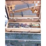 Large tool chest on feet and contents including saws, planes, pliers, chisels etc