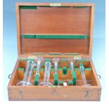 Edward VII cased set of Monmouthshire County Council standard glass measuring cylinders, largest 1/2