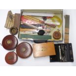 A boxed two drawer drawing set marked WH & S, measuring tapes, slide rules etc