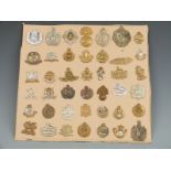 Approximately 50 British Army cap badges including the 'Buffs', Gloucestershire Regiment, 4 Royal